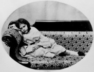 Edith M. Liddell (on sofa)